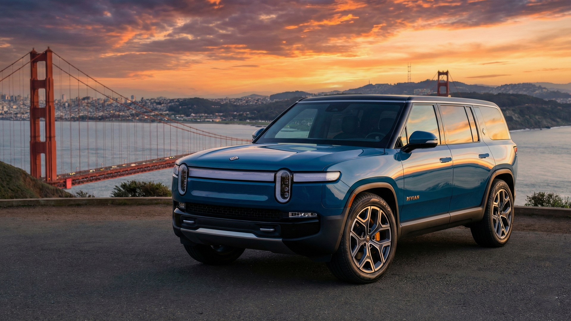 Sell Your Rivian R1S in San Francisco Blue Rivian R1S parked near the Golden Gate Bridge at sunset, ready to sell in California.