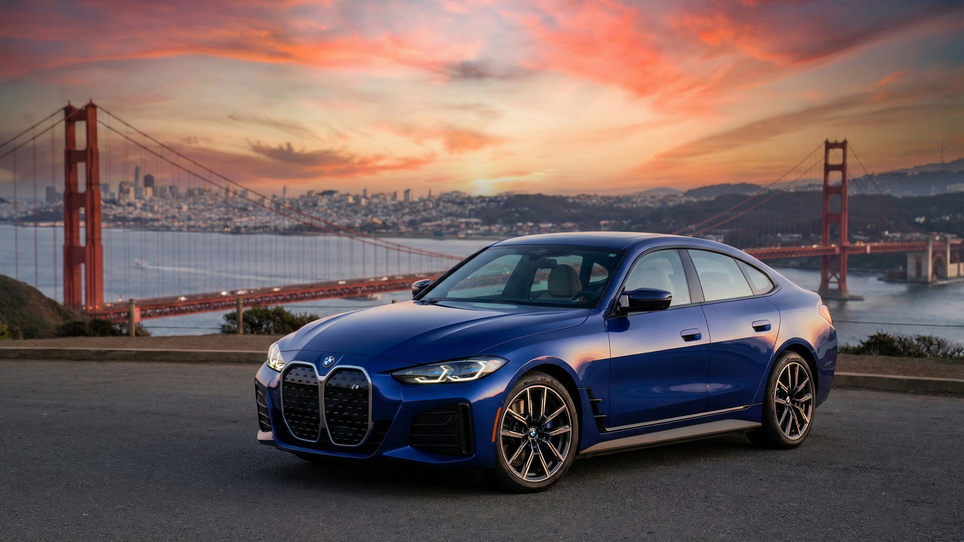 BMW i4 blue sedan parked near the Golden Gate Bridge at sunset, ideal for California drivers ready to sell their car.