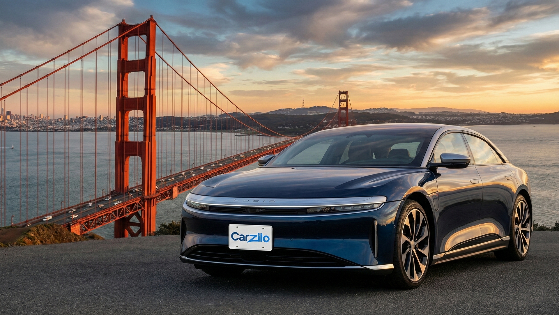 Sell Your Lucid Air Touring In California Lucid Air Touring blue electric sedan parked near the Golden Gate Bridge at sunset, ideal for California owners ready to sell their car.
