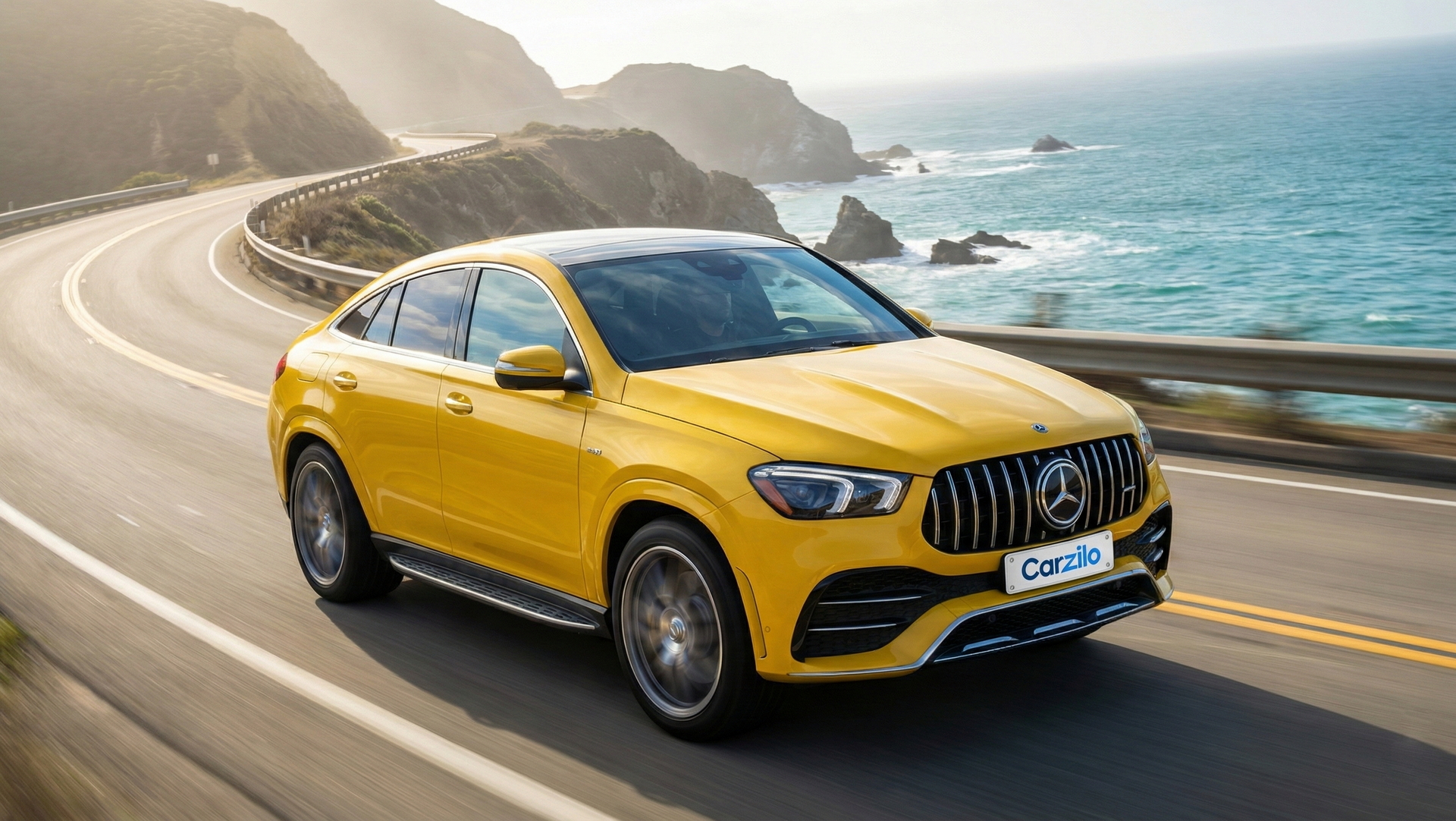 Mercedes-AMG GLE 53 Coupe in bright yellow driving along the California coast, ideal for owners looking to sell their SUV quickly.